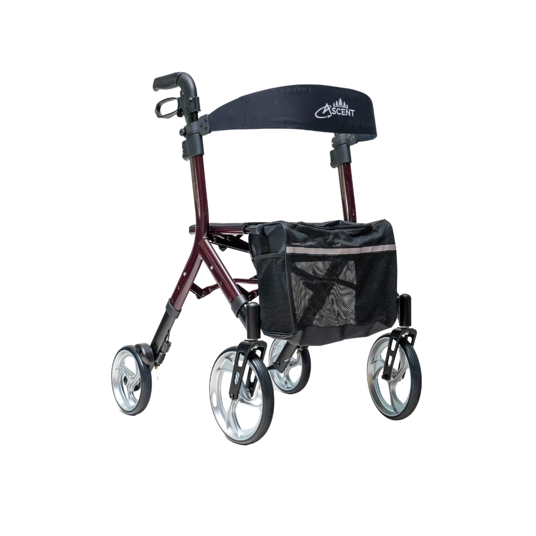 The Compass Health Ascent Premium Euro-Style Rollator features a red frame, four wheels, a black cushioned seat with Ascent on the backrest bar, a storage bag, lightweight design, and handles for easy mobility support.